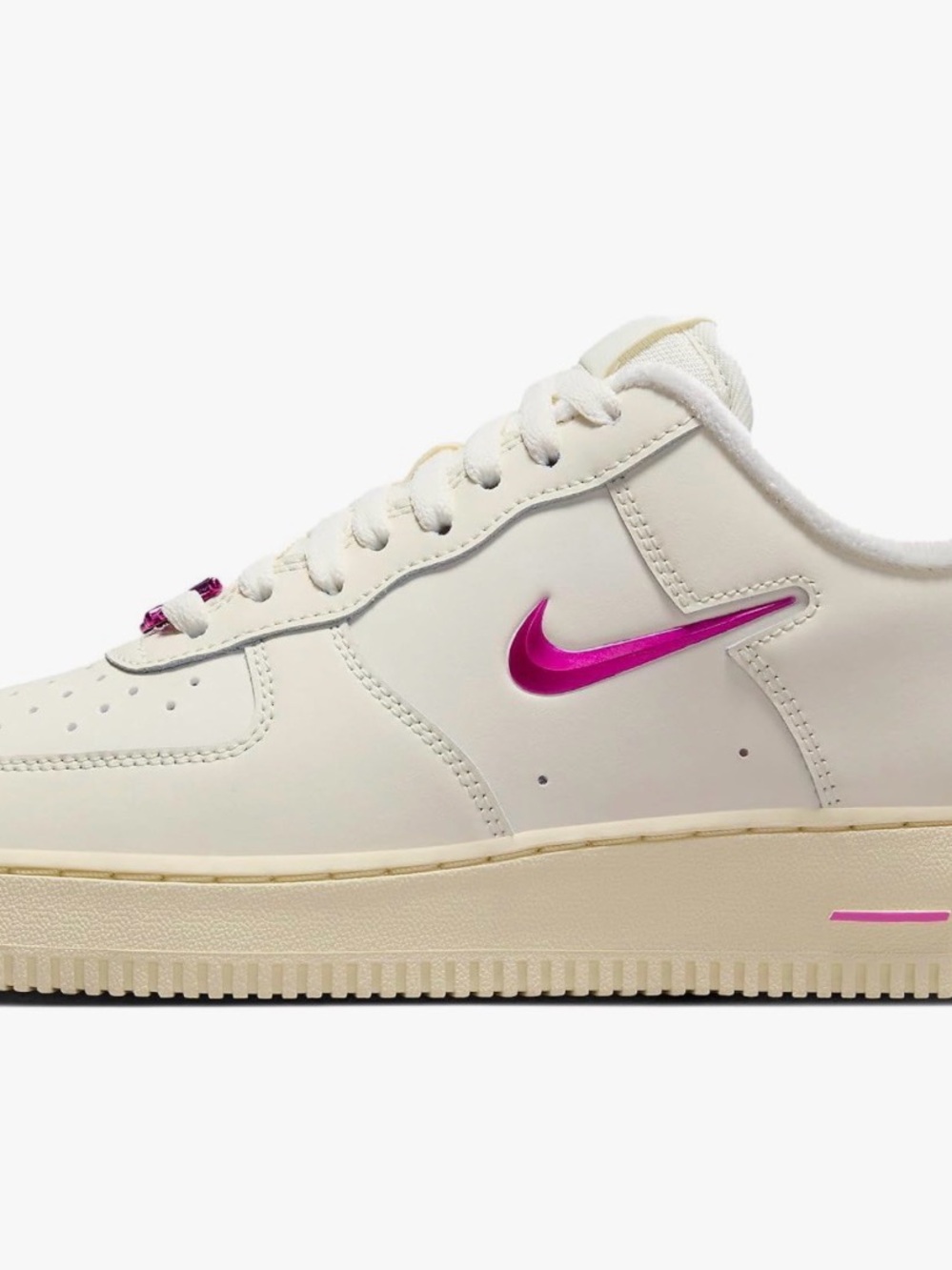 Nike Women's Cream Sneaker with Pink Metallic Swoosh